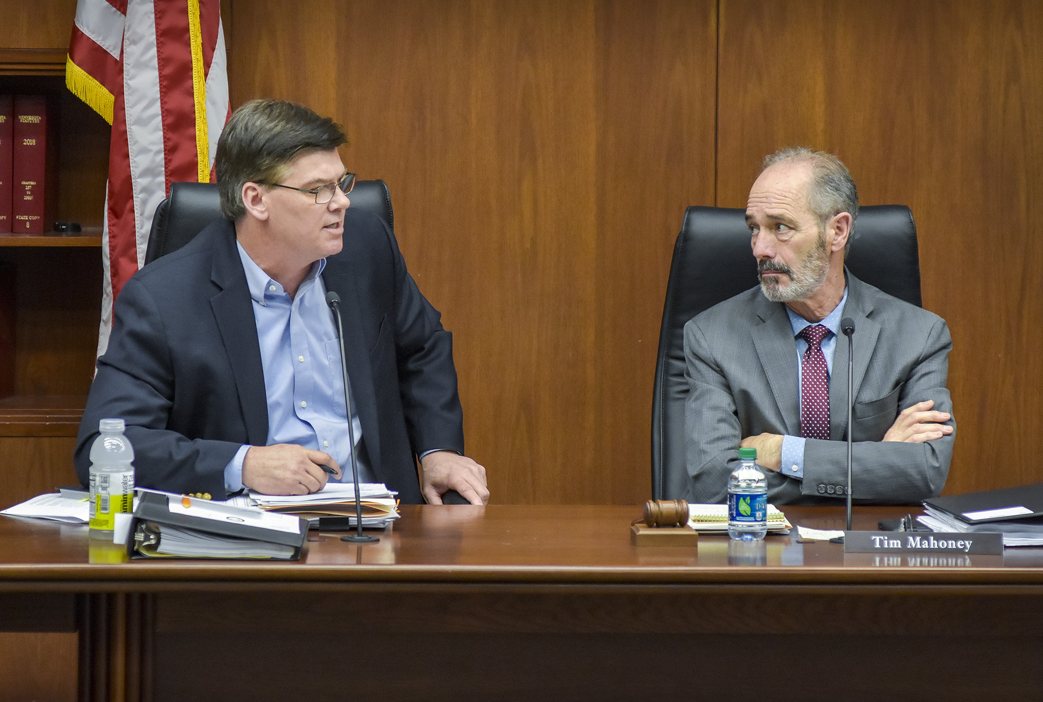Sen. Eric Pratt and Rep. Tim Mahoney begin the conference committee for the omnibus jobs and economic development, energy and climate, and telecommunications policy and finance bill by discussing why the meeting was taking place. Photo by Andrew VonBank